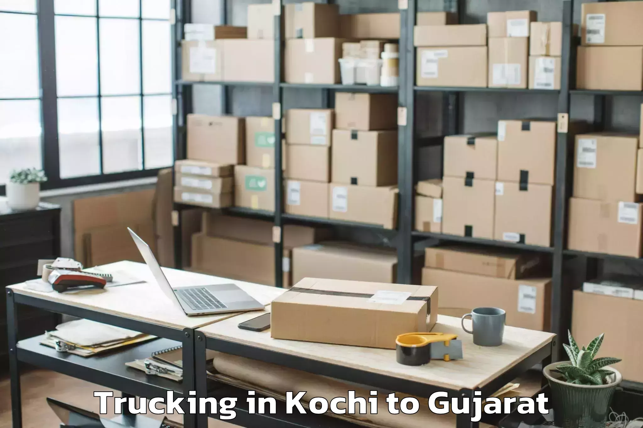 Kochi to Dhoraji Trucking